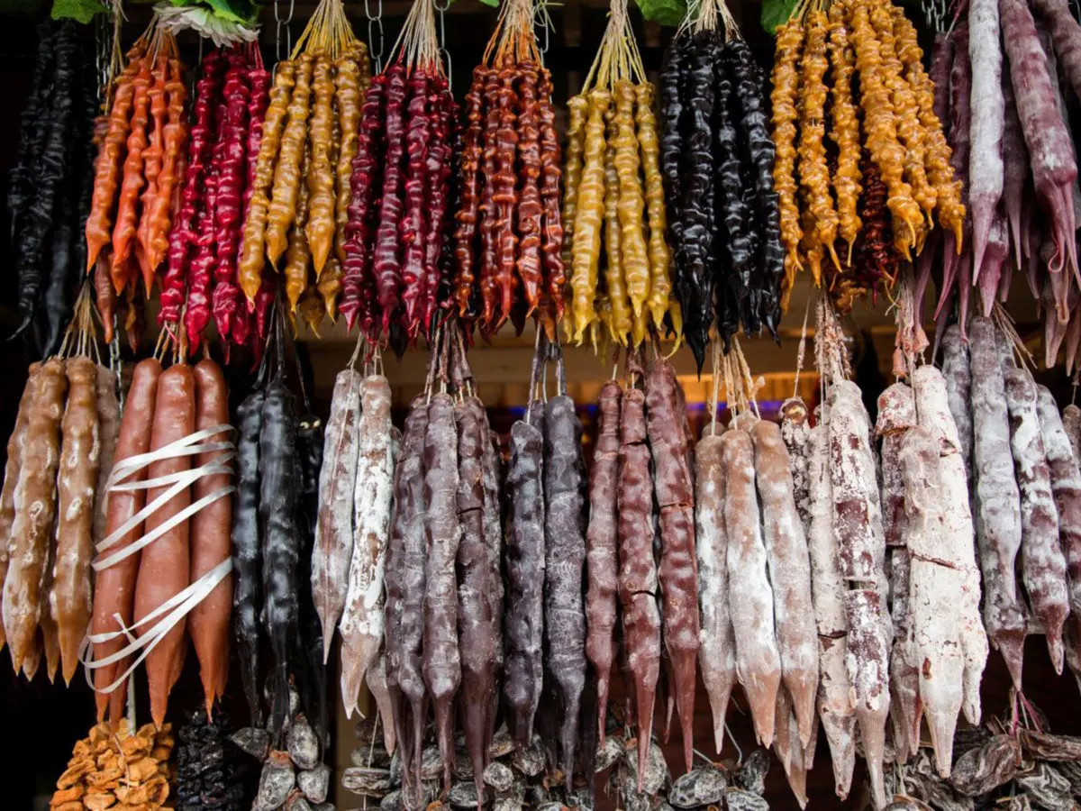 churchkela are a georgian delicacy of walnuts covered in grape juice caramel