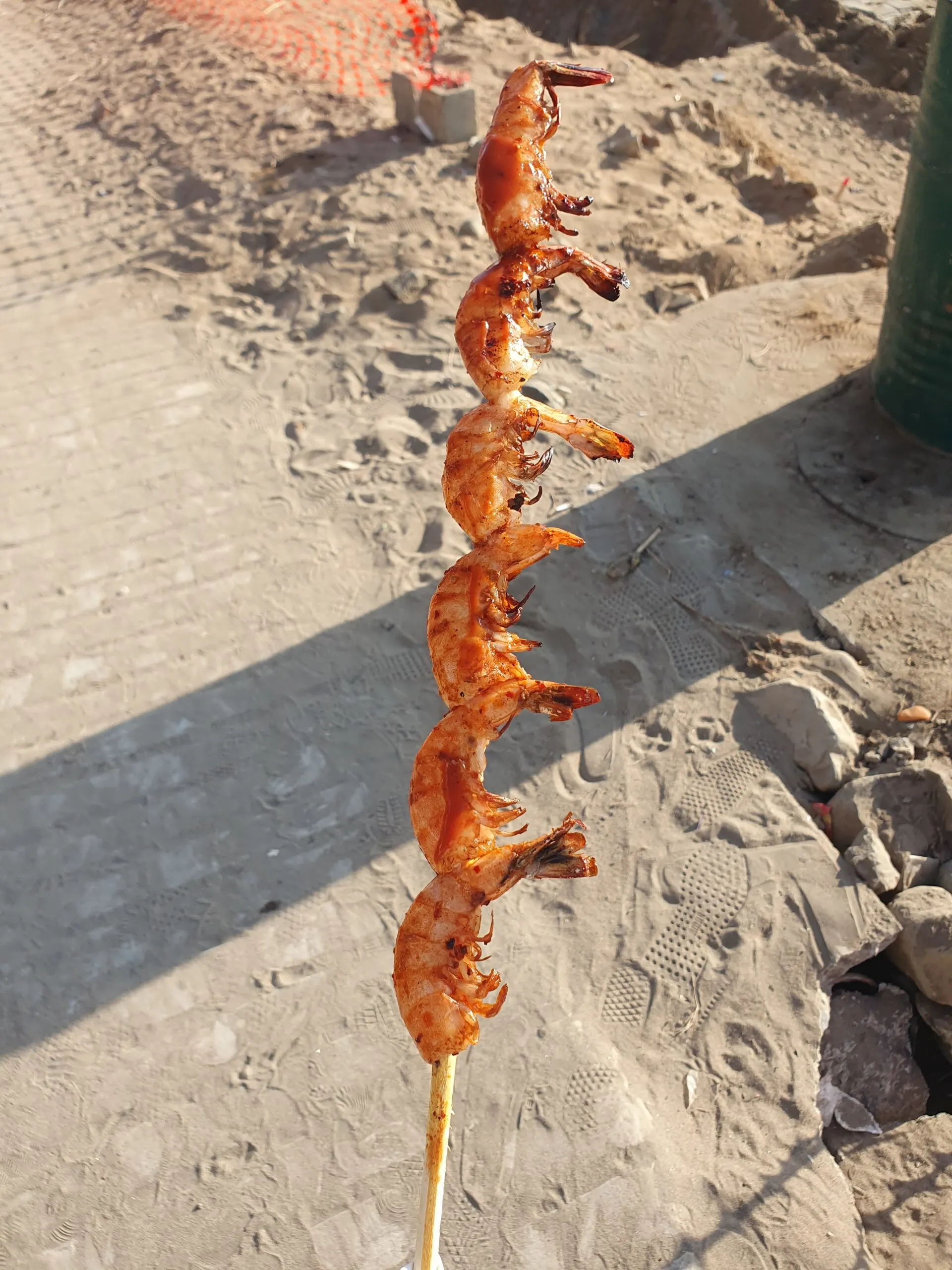 sampling street food like this shrimp skewer is one of the best things to do in tijuana