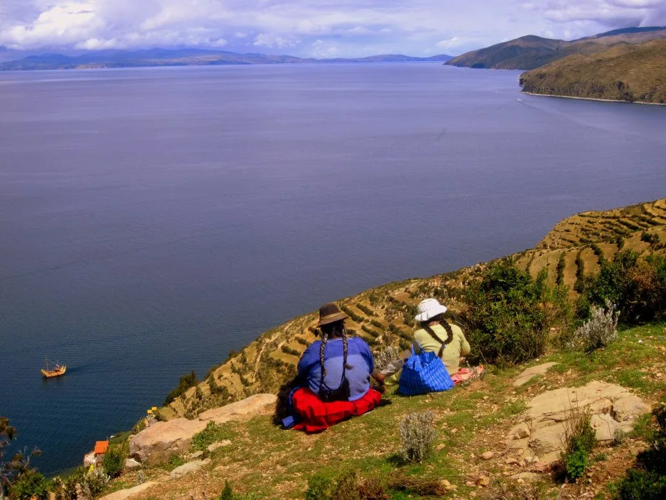 isle del sol bolivia with 2 woman sitting