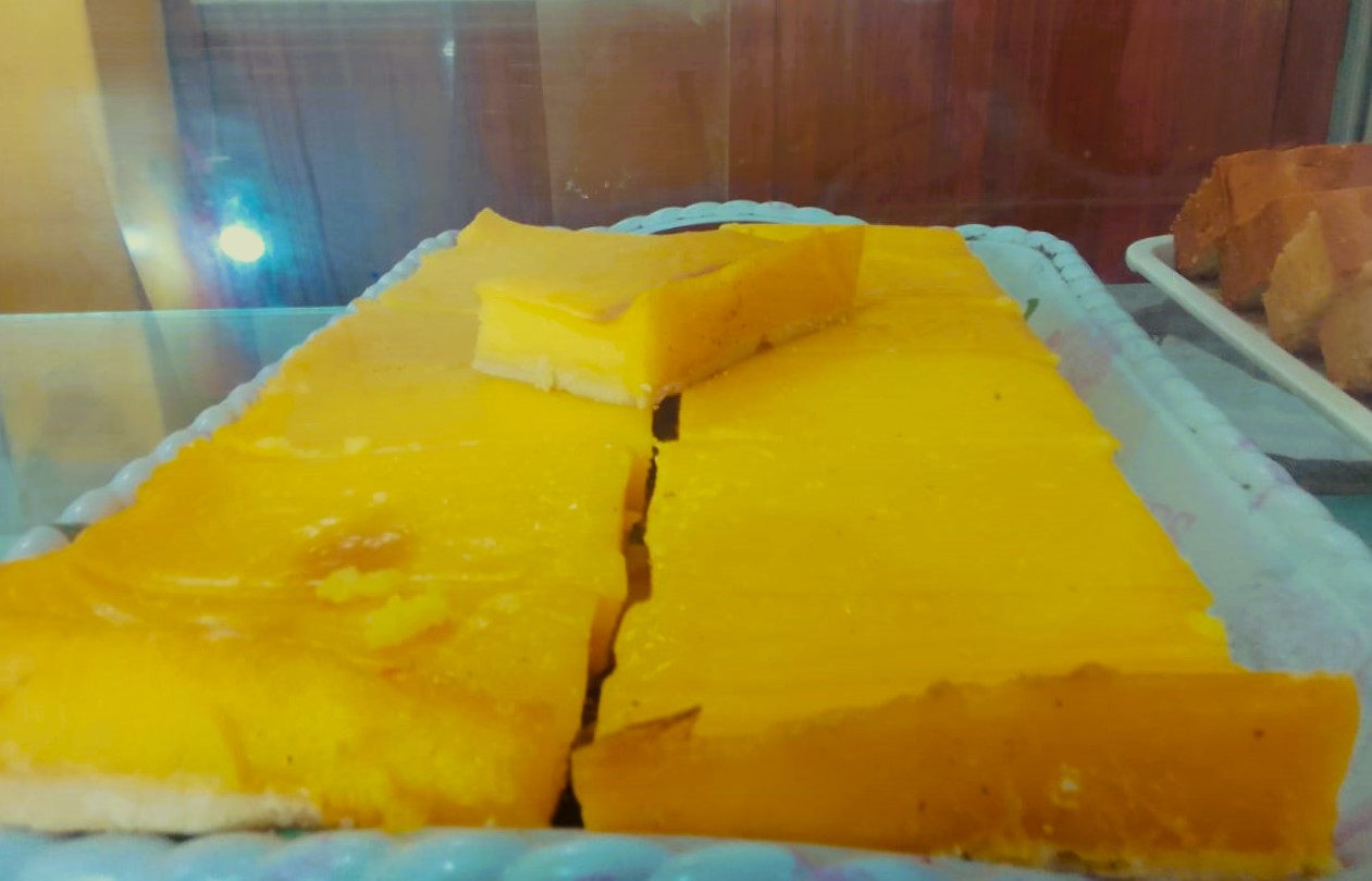 Mauritian dessert chemin de fer in a display case 