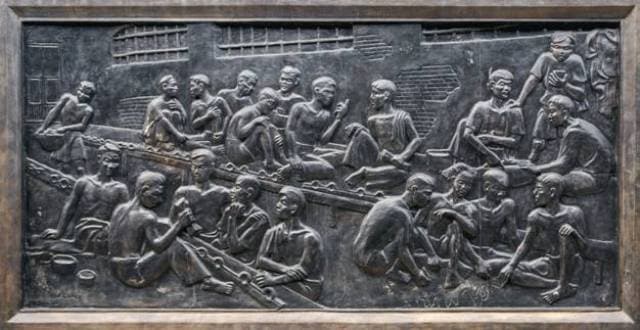 Mural reliefs showing behind-the-scenes of what life was like at the Hoa Lo Prison