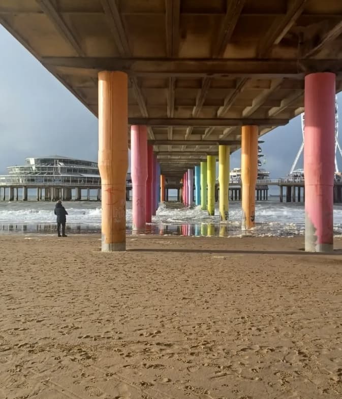 colourful pillars underneath scheveningen pier in den haag the netherlands