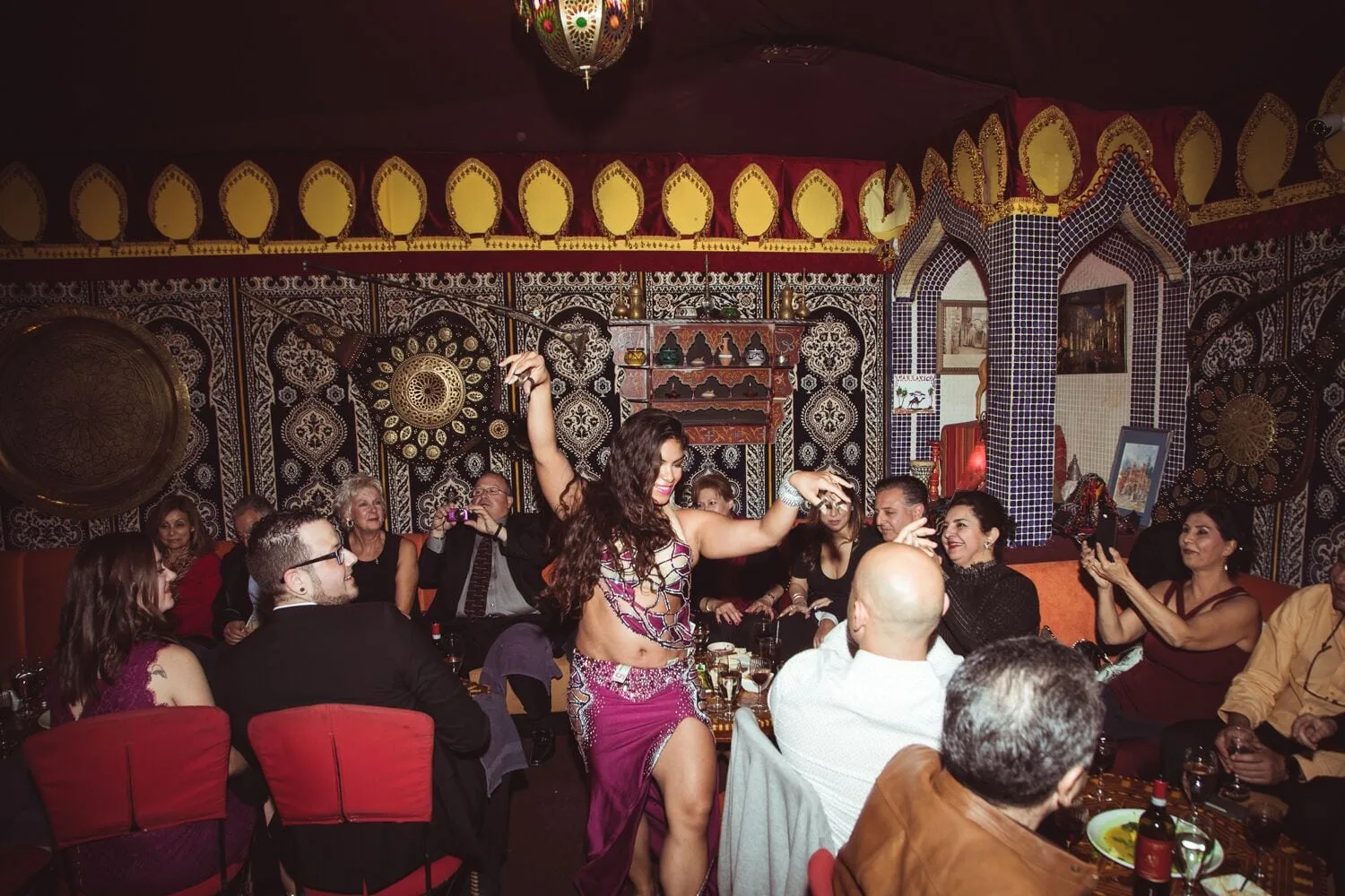 a belly dancer in Moroccan attire entertains diner at marrakech mediterranean restaurant in las vegas nevada usa