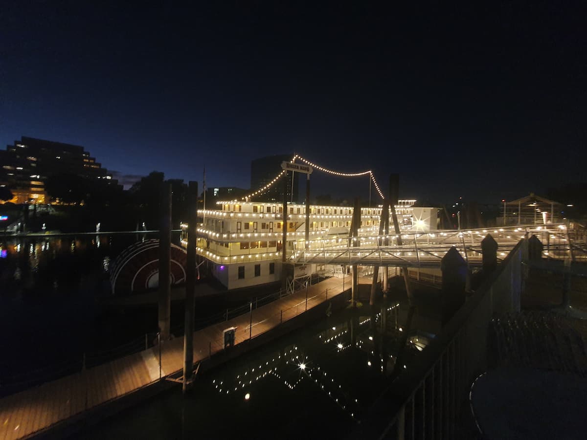a moored paddle steamer lit up at night is the delta king hotel in sacramento california usa