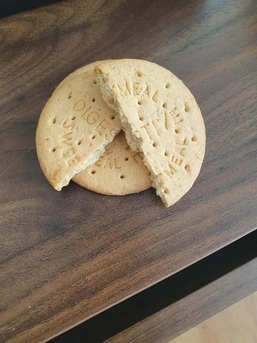 two digestive biscuits on a brown table