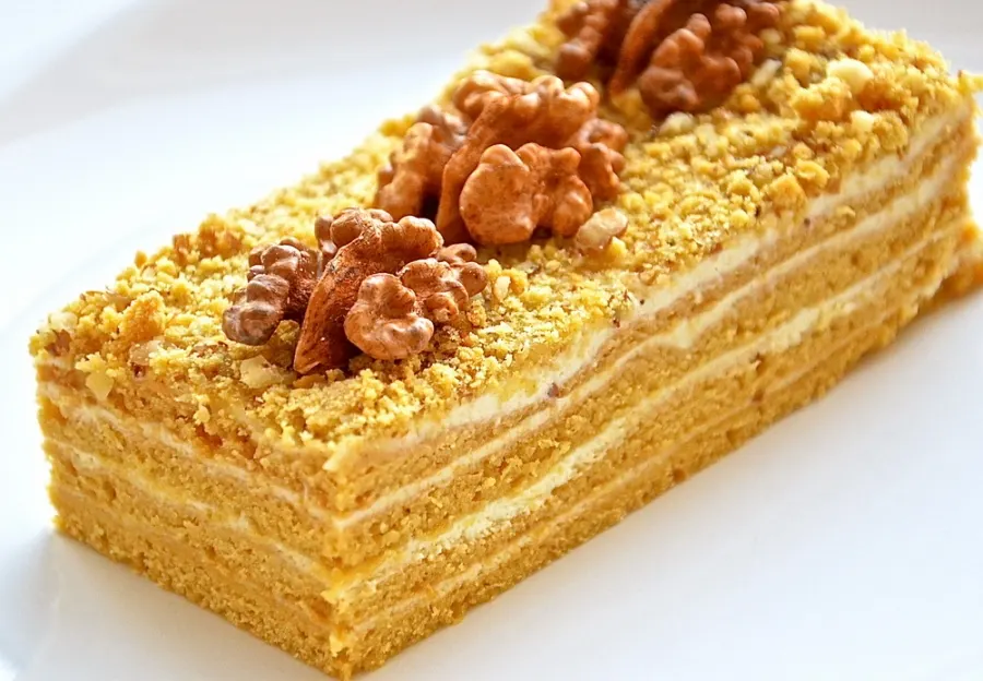 medok is a layered cake made with honey and cream topped with walnuts and is popular as a dessert in georgia
