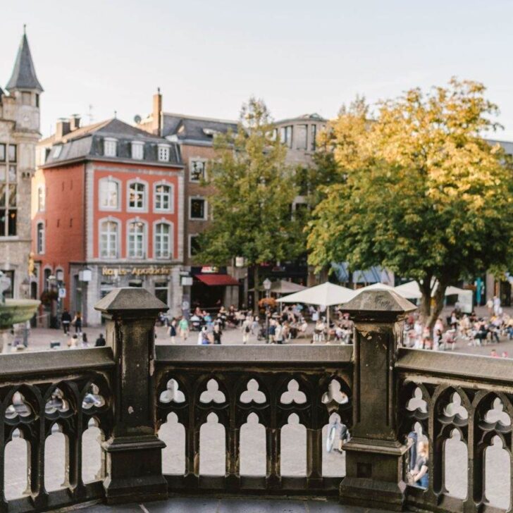 A town square seen in Aachen with people in it
