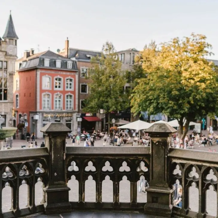 A town square seen in Aachen with people in it