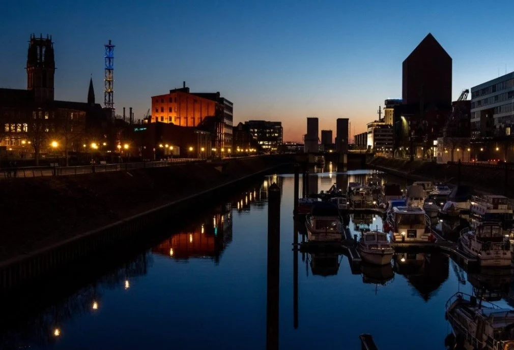 Inner harbor and waterfront of Duisburg seen on a still evening.