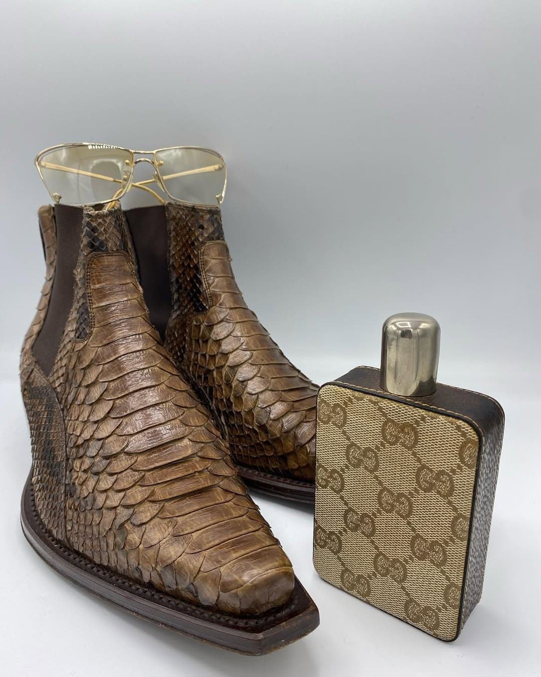 Gucci flask and D&G sunglasses, with vintage boots