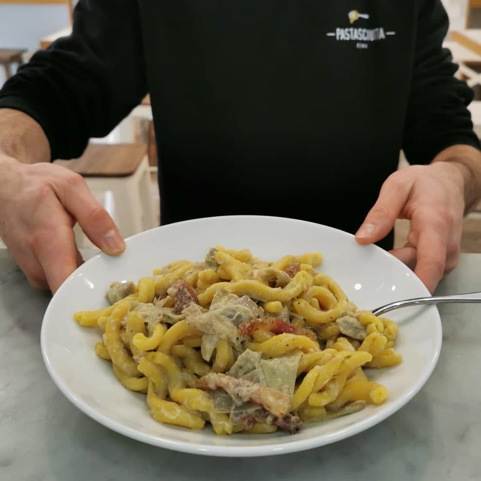 A bowl of strozzapreti; a thick, twisty type pasta originally from the Emilia-Romagna region
