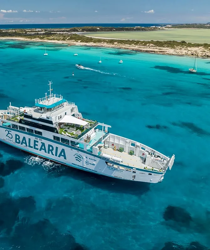 a balearia ferry in the blue waters of the mediterranean off the coast of ibiza spain
