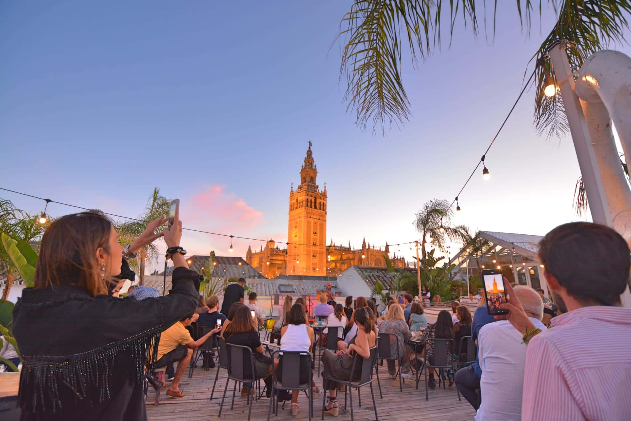 Crowds watching the flamenco performance on the rooftop