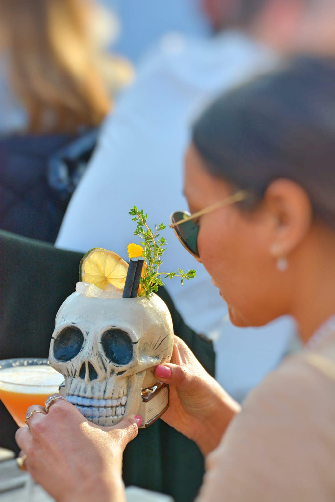 Cocktail served in creative glassware like this skull