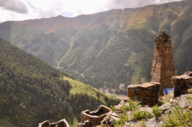 an old stone wall overlooking a valley in tusheti national park georgia