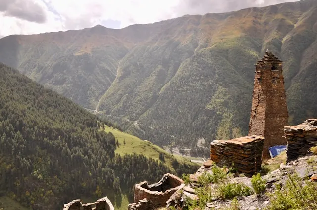 an old stone wall overlooking a valley in tusheti national park georgia