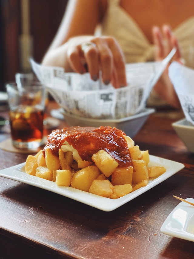 patatas bravas are commonly eaten as tapas in spain