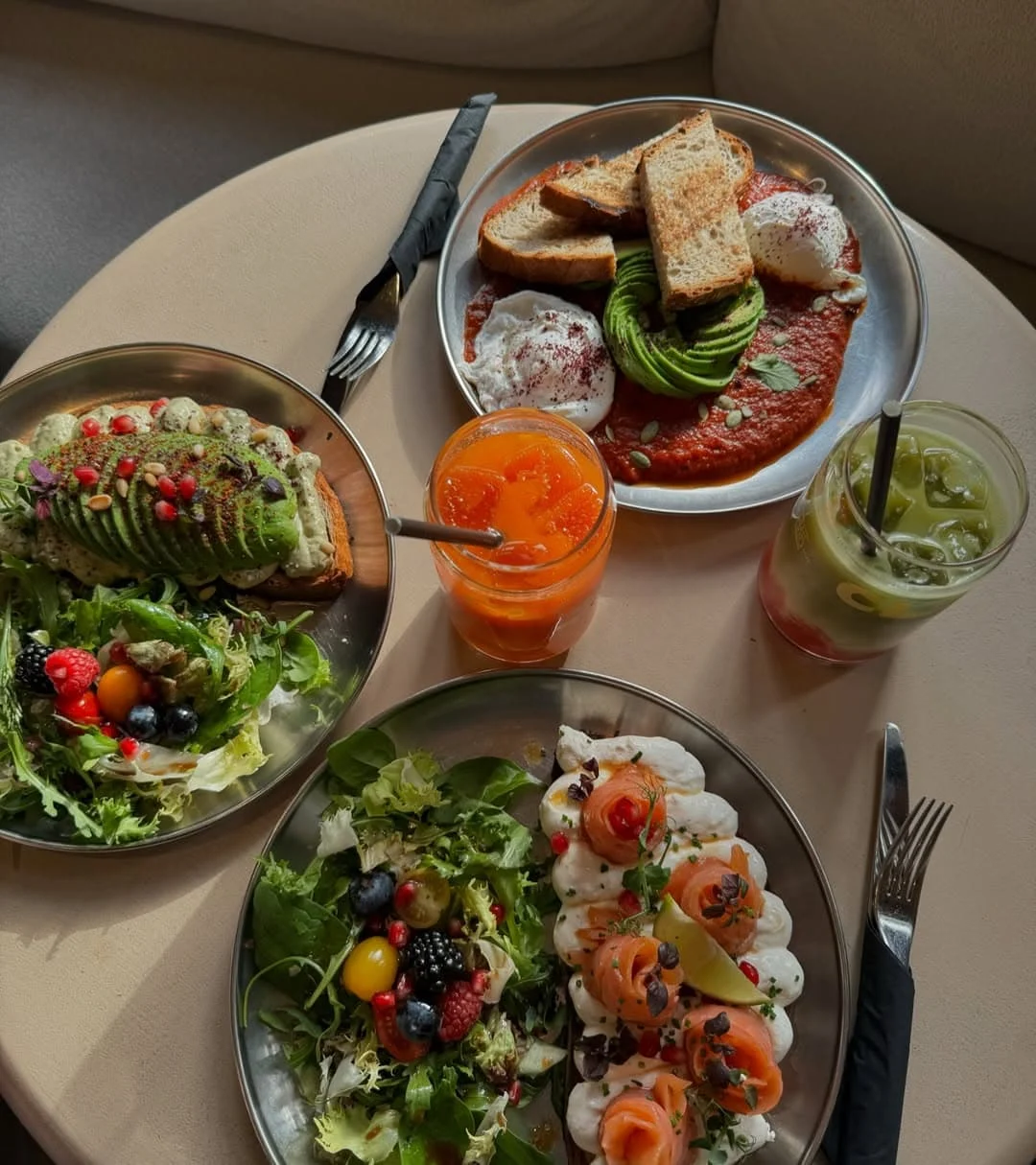 An array of breakfast and brunch plates and fresh health juices