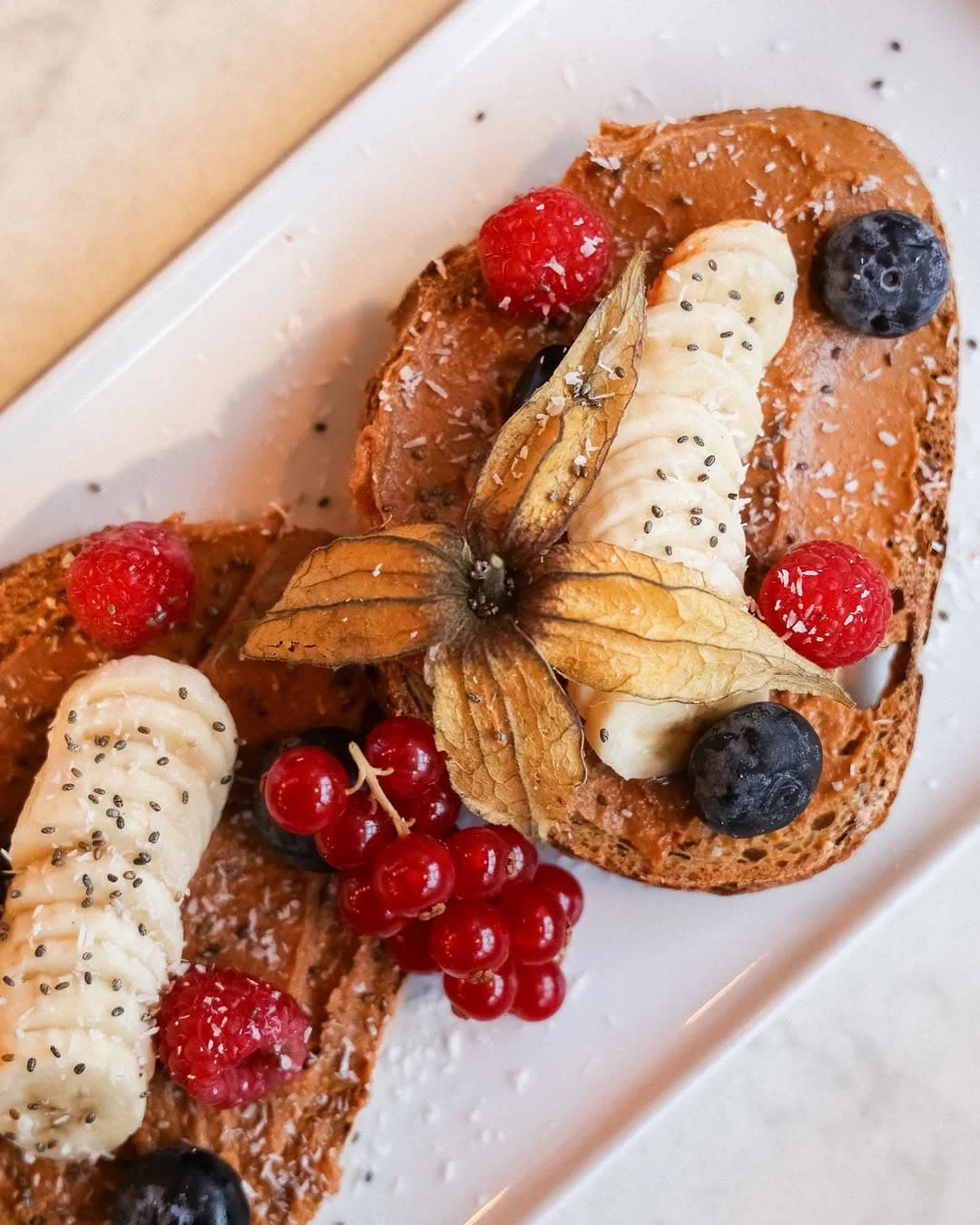 Banana and peanut toast with berries