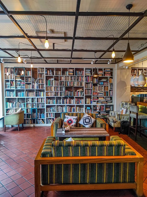 Interior of Bodhi Books & Bakes with bookshelves and couches 