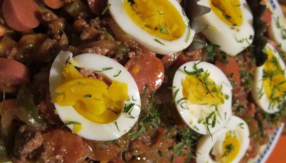 Pique macho, topped with boiled eggs, on a plate