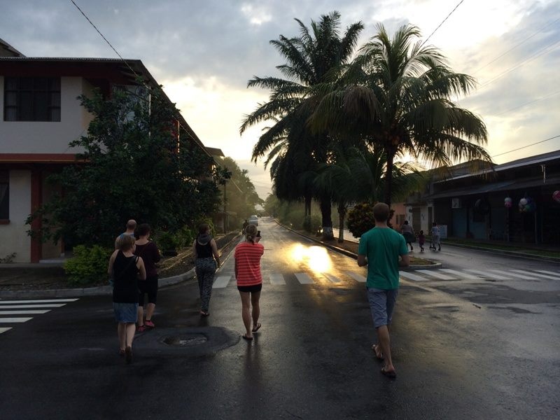 People walking on a street of a tropical town