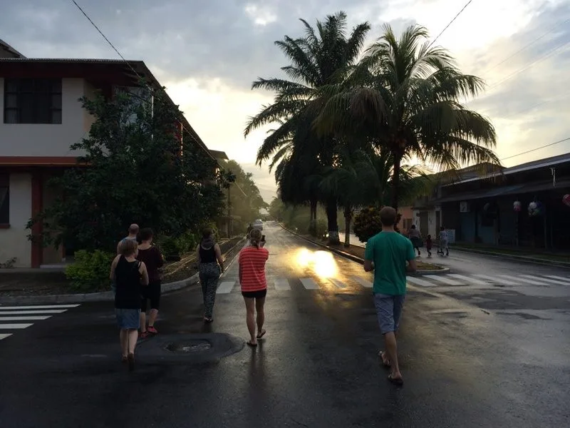 People walking on a street of a tropical town