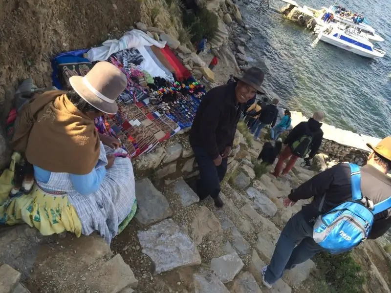 Merchants and tourists on the shores of Lake Titicaca on your 2 week bolivia travel itinerary