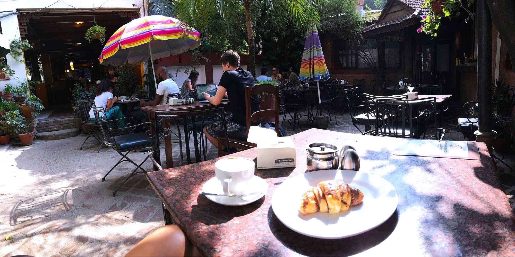 A cafe courtyard with outdoor seating at one of the best cafes in Kathmandu 
