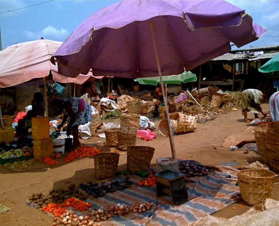 A vibrant, colorful street market with vendors in Equatorial Guinea