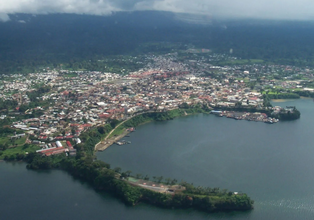 Malabo city seen from the air, surrounded by the green forests of Bioko island