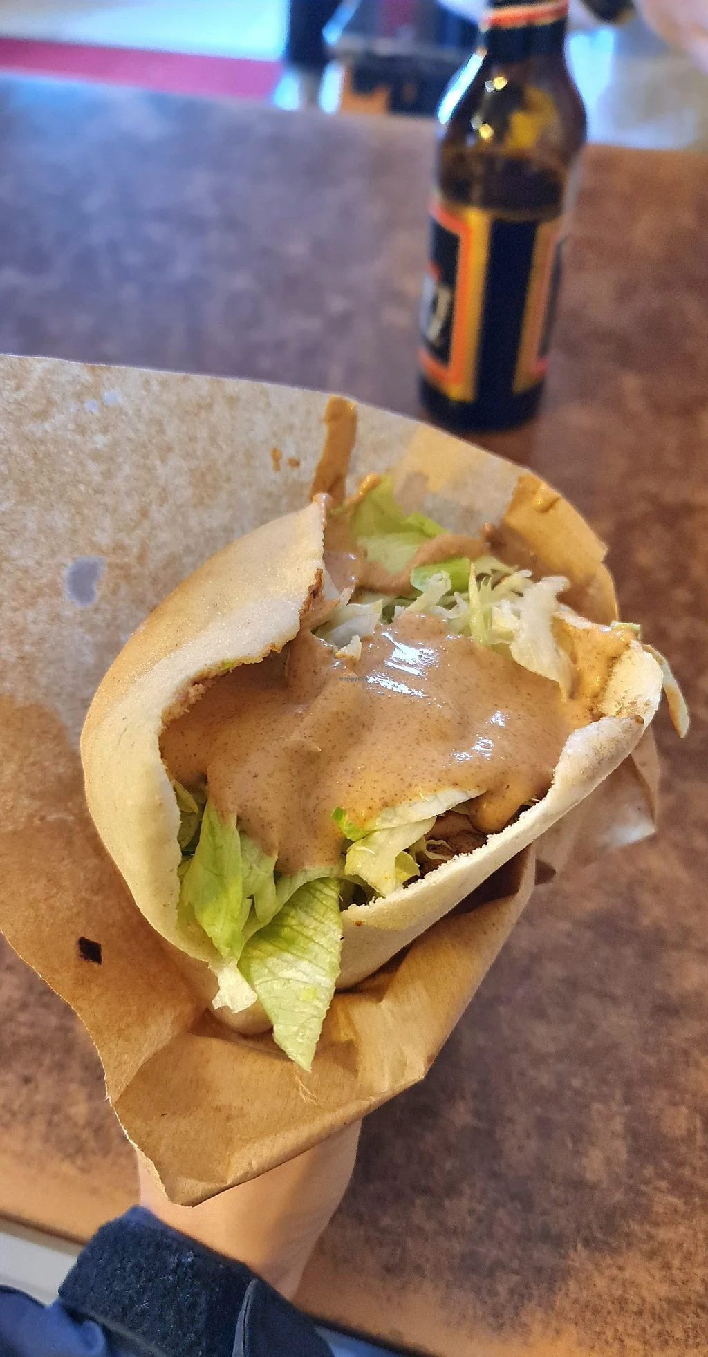 falafel served in pita bread with salad and peanut sauce from sahara imbiss sudanese restaurant in berlin germany