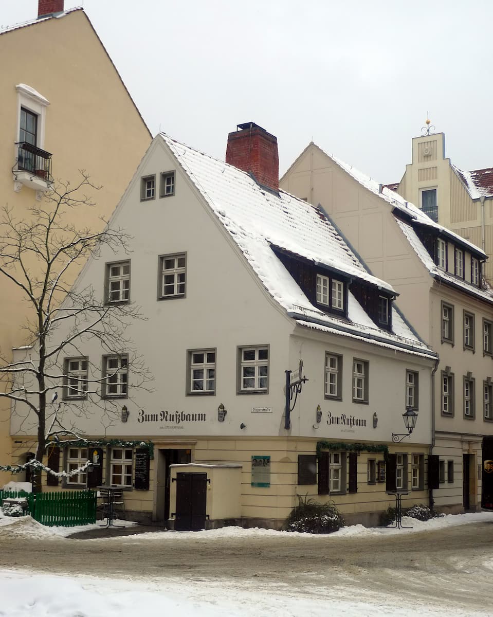 a historic white building home to Zum Nußbaum in Berlin Germany