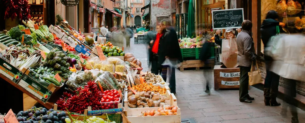 a market stall selling fruit and vegetables in mercato di mezzo food market in bologna italy
