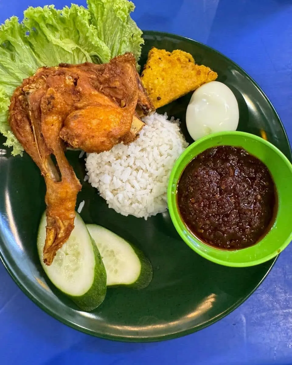 Sometimes Nasi lemak is served with fried chicken