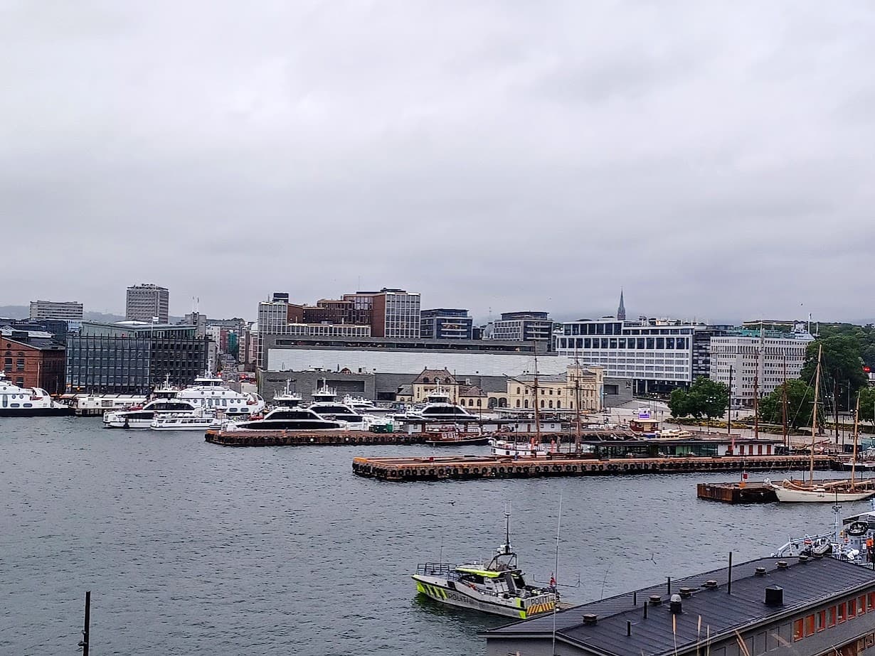 ferries in a harbor at aker brygge in oslo norway