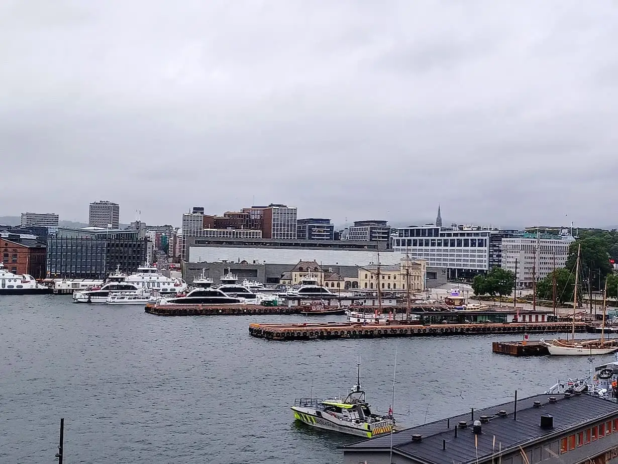 ferries in a harbor at aker brygge in oslo norway