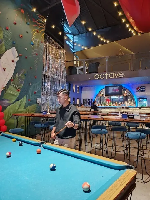 Interior of a pub showing a pool table and bar