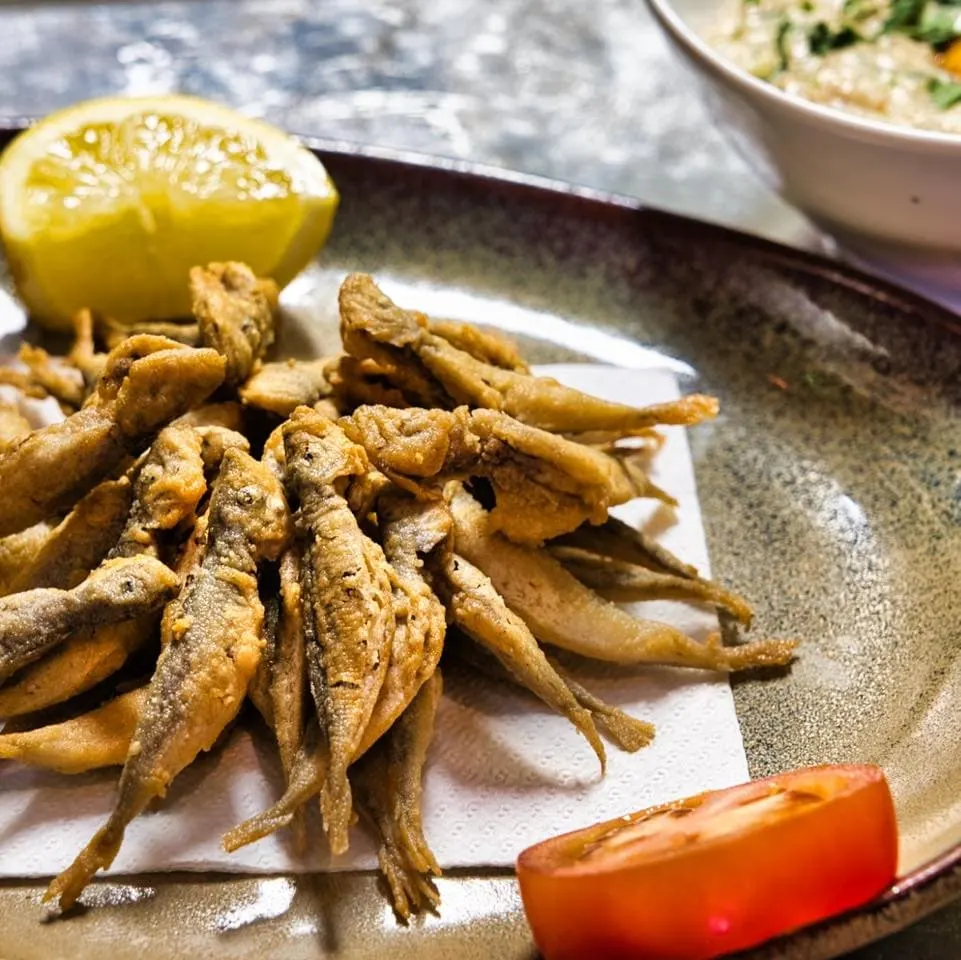 Traditional Portuguese dishes like fried anchovies