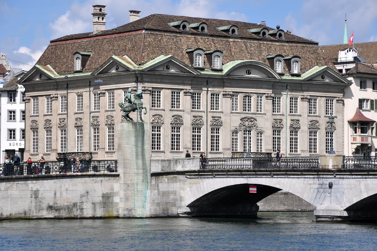 a stately home on a river bank is zunfthaus zur meisen a fondue restaurant in zurich switzerland