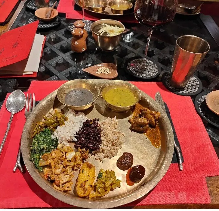 Nepalese curries served on a copper thali plate