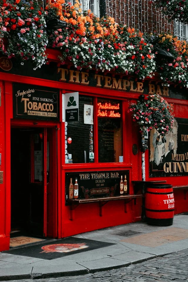 the black and red exterior of the temple bar in temple bar dublin ireland