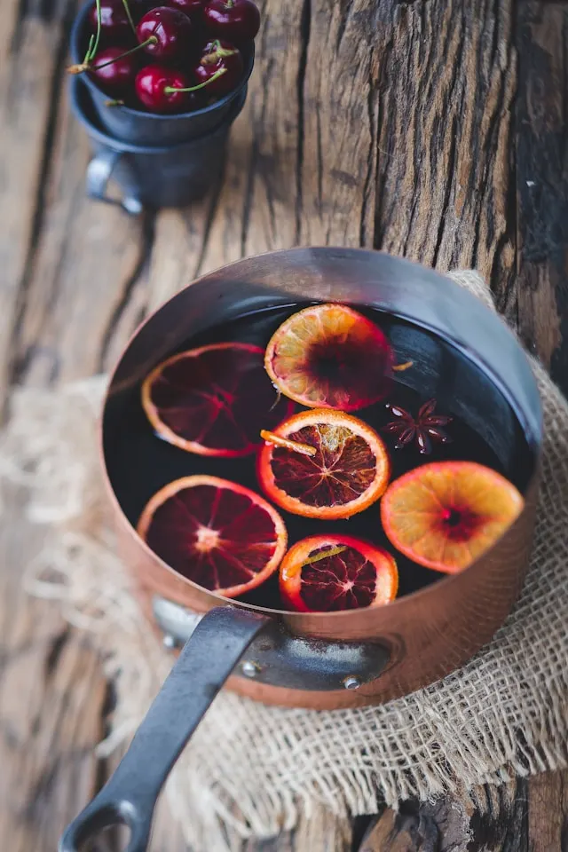 oranges soaking in red wine to be made into glühwein
