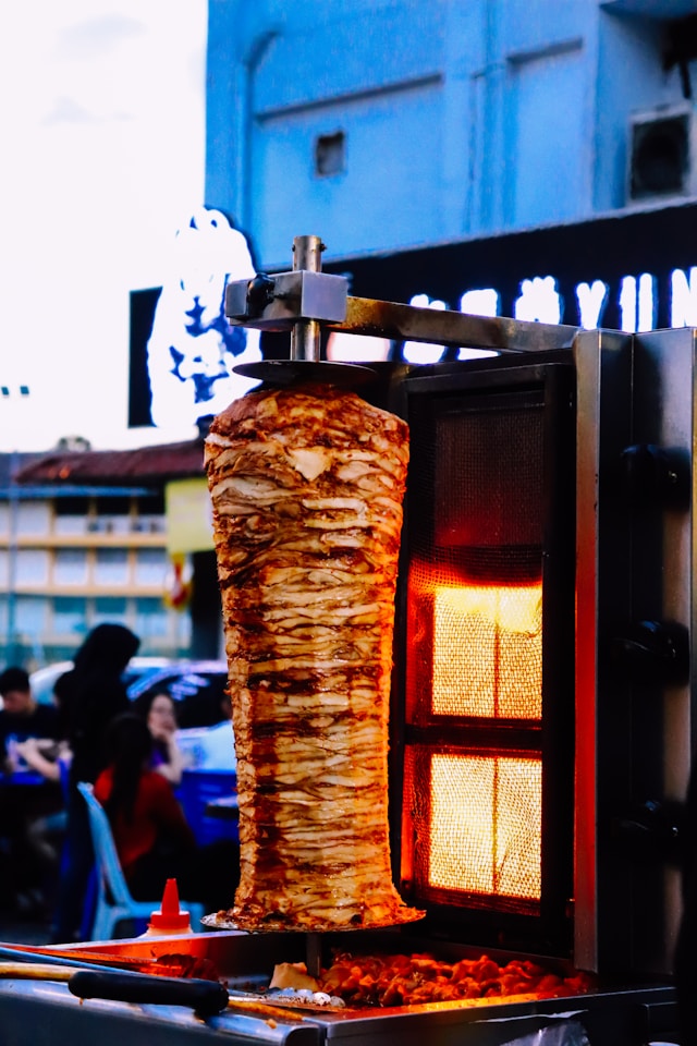 doner kebab being cooked on a rotisserie