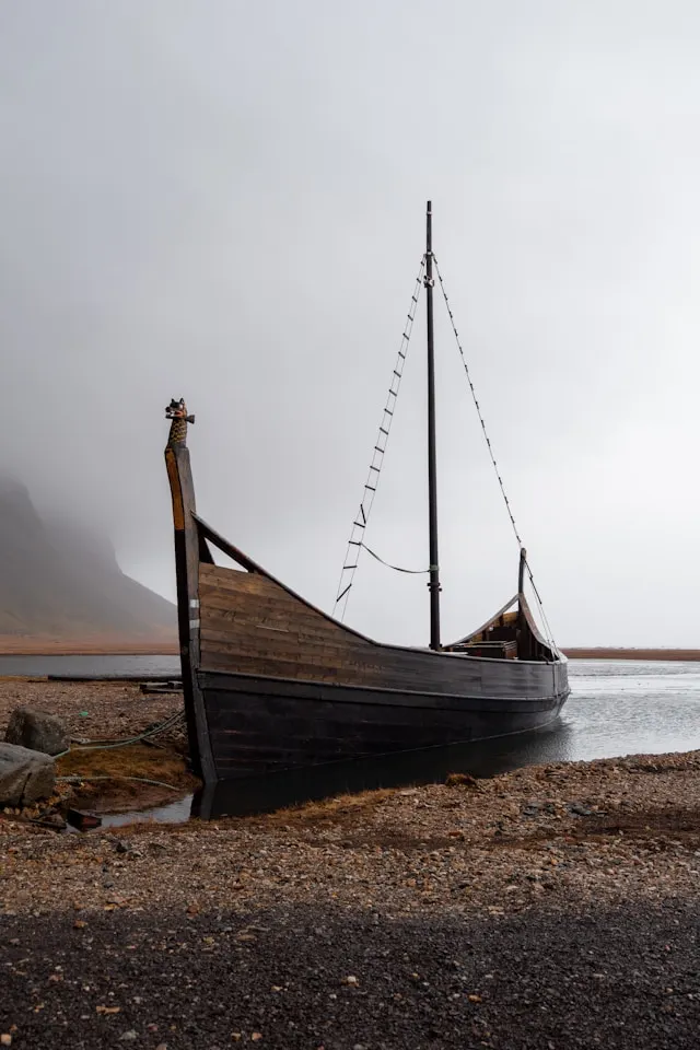 a replica viking galley longship on a beach
