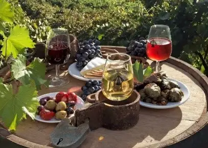 A table set with wine glasses and healthy snacks