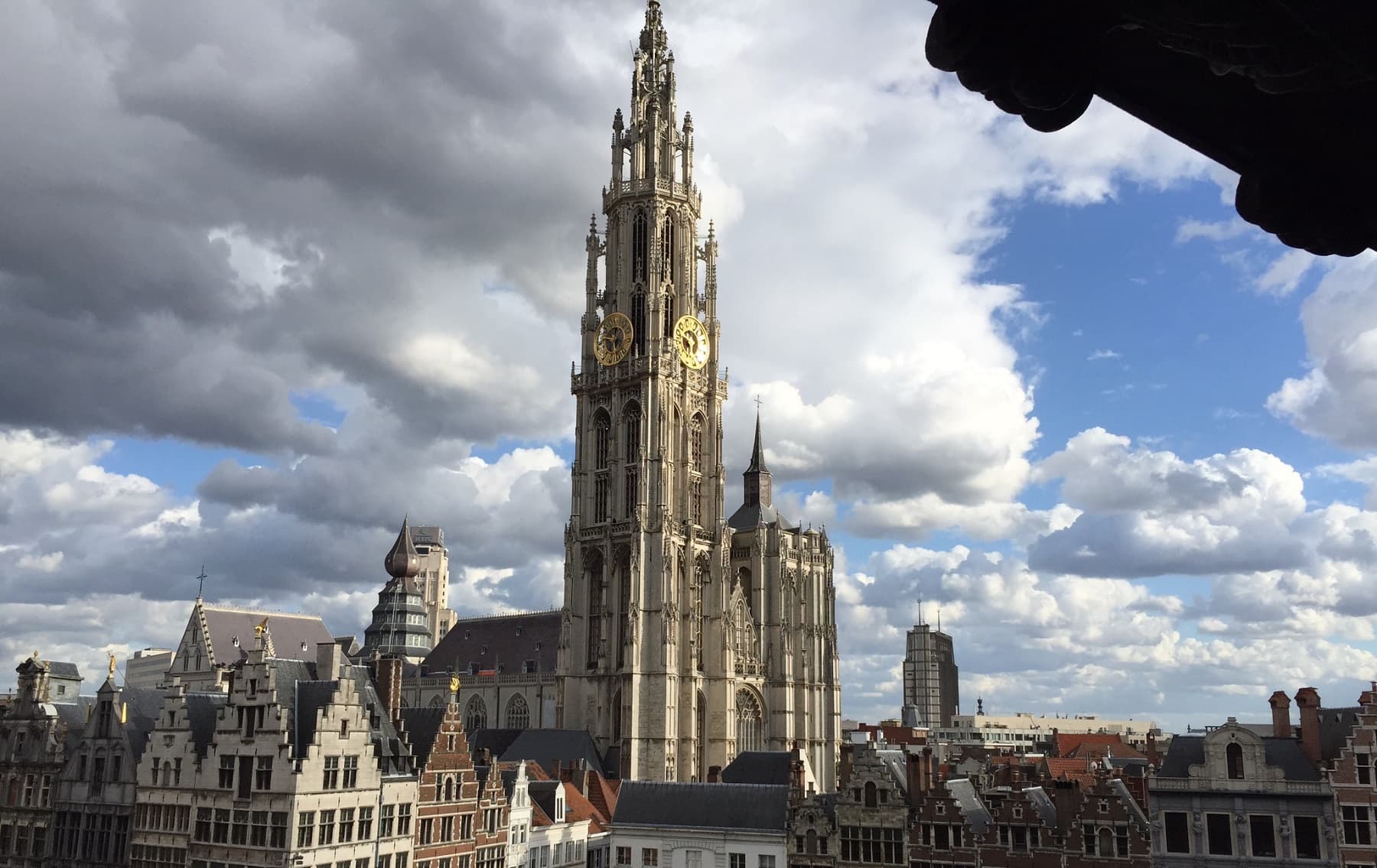 a steeple on a gothic cathedral in antwerp belgium