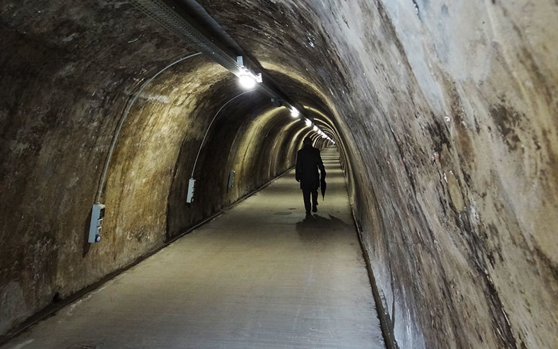 a man walks through tunnel gric in zagreb croatia 
