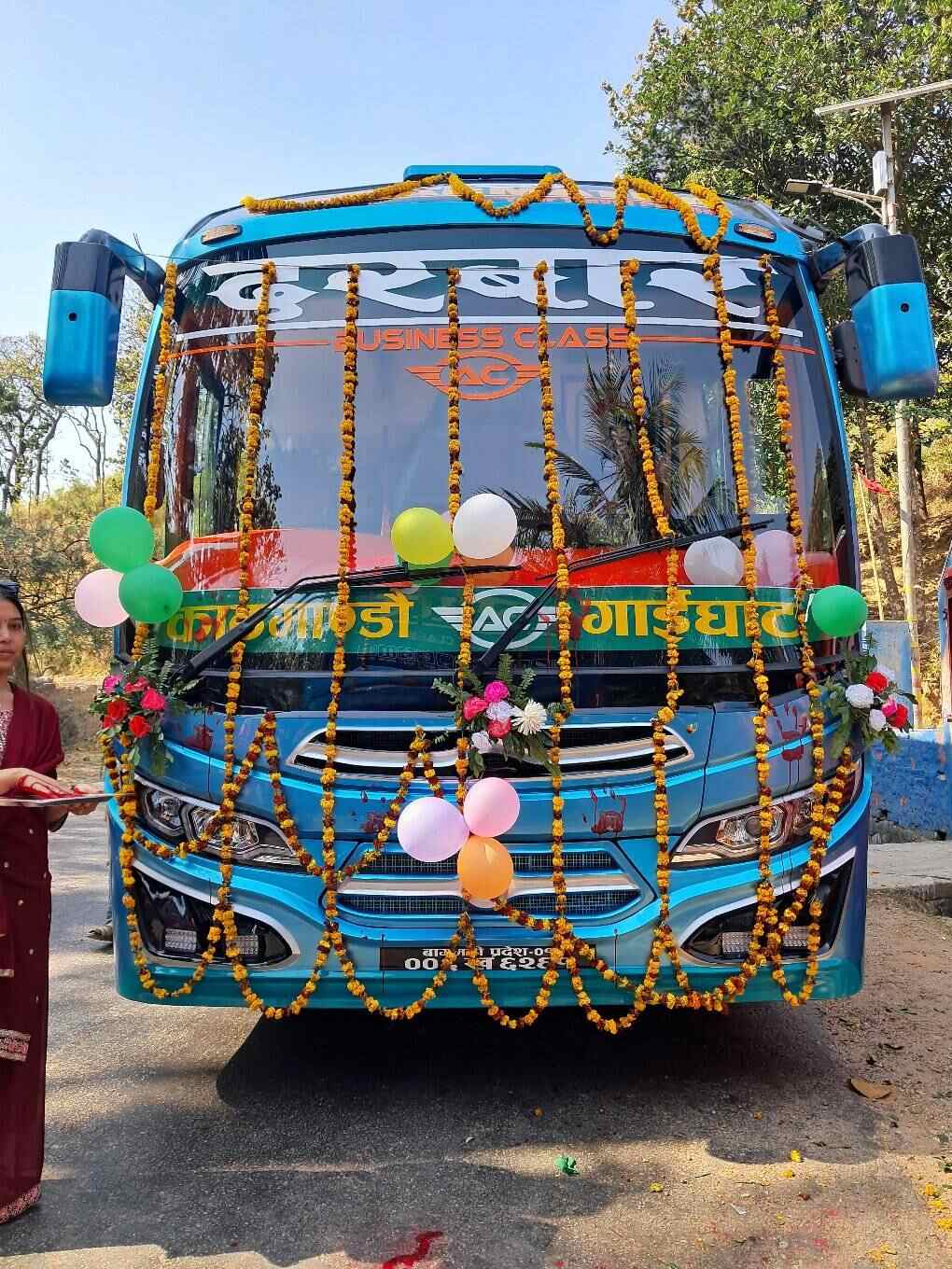 Bus decorated with flower garlands