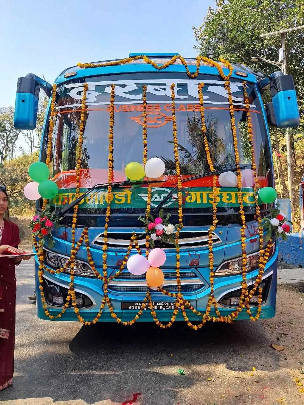 Bus decorated with flower garlands